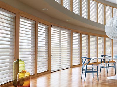home interior with many windows featuring slatted hunter douglas blinds