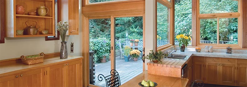 contemporary-sliding contemporary sliding doors in kitchen with light-colored wood