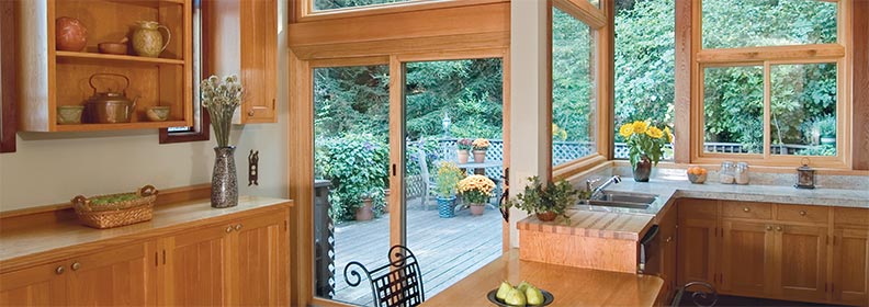 contemporary sliding doors in kitchen with light-colored wood