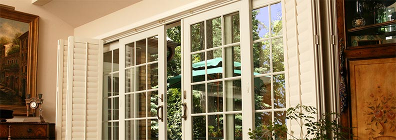 french-sliding-patio-door French sliding patio doors with white grilles open to outdoor patio