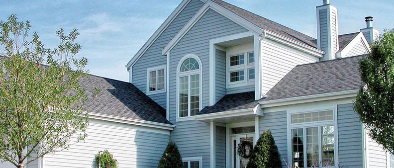 Dickinson home featuring white stainless steel siding and gray roofing