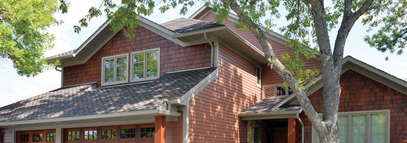 Minot home featuring brick-colored stainless steel siding