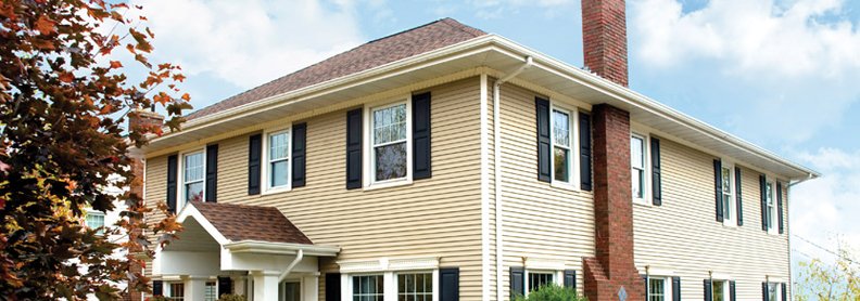 home with tan seamless steel siding and reddish roofing in Willmar