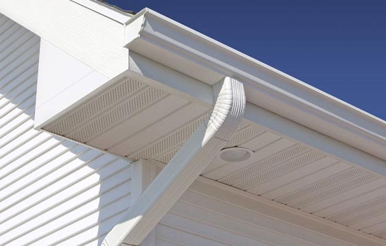 Rain carrying system white gutters home exterior