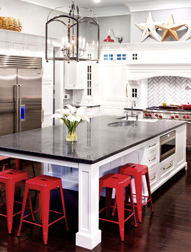 bright white kitchen with red accents and white cabinets