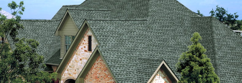 gray GAF asphalt roofing on large home