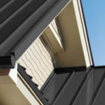 MetalRoofing_LandingPageSeamlessMetal_259x299 building exterior showcasing detail on dark gray seamless metal roofing