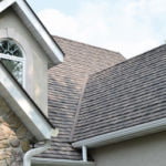 MetalRoofing_LandingPageStone-CoatedMetalShingle_259x299 home exterior featuring detailing on dark gray stone-coated metal shingle roofing
