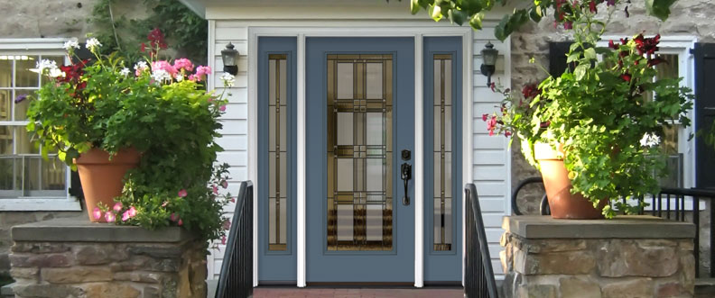 blue ProVia door with three decorative windows on a white house
