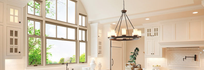 RBA_DoubleHungWindows_790x271 home interior kitchen with three double hung windows and accent windows above