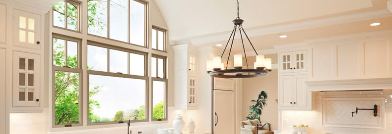 home interior kitchen with three double hung windows and accent windows above