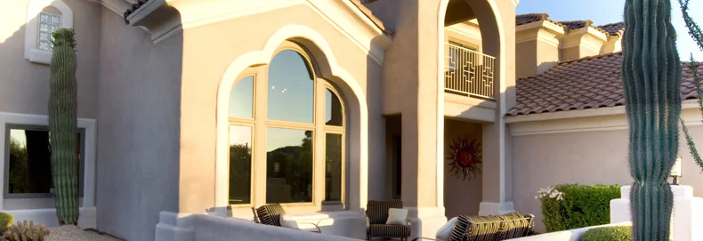 RBA_SpecialtyWindows_790x271 adobe home featuring large windows with curved tops