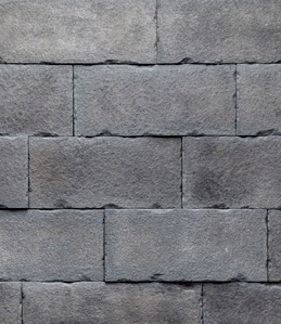 close up of dark gray carved block Versetta stone siding