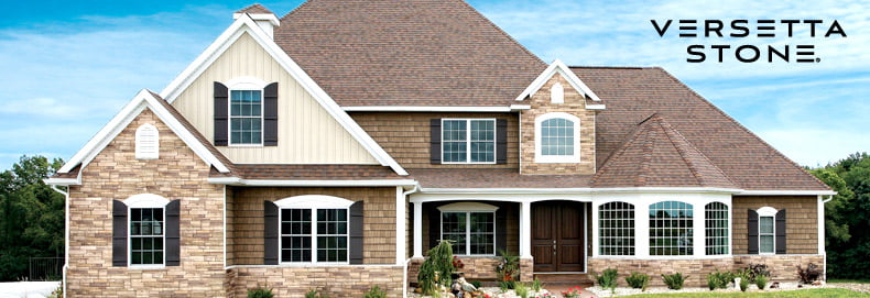 home exterior featuring tan tight-cut Versetta stone siding contrasted with various tan siding types types in shades of tan