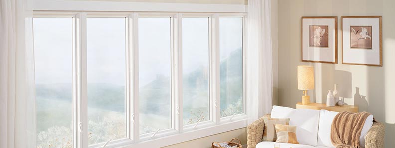 home interior with five large casement windows and couch