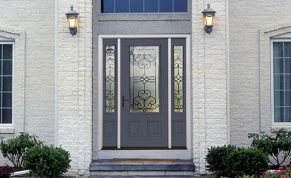 steelprofiledoor blue steel Therma-Tru door with three decorative windows on a white house