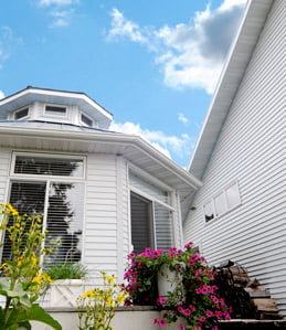 home exterior featuring medium shot of white United States Seamless Siding on specific wall angles