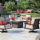 revive cushion swivel rockers surround fire table in a garden
