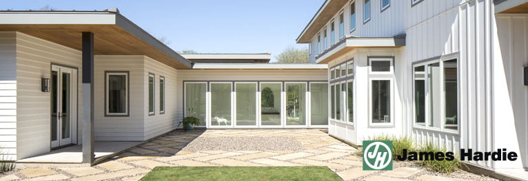 James Hardie fiber cement siding on a white building with flat roof