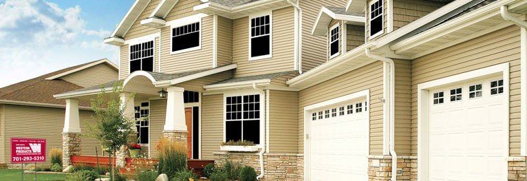 tan seamless siding exterior with gray roof and white trim