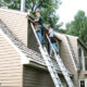 Western Products workers put finishing touches on seamless steel siding