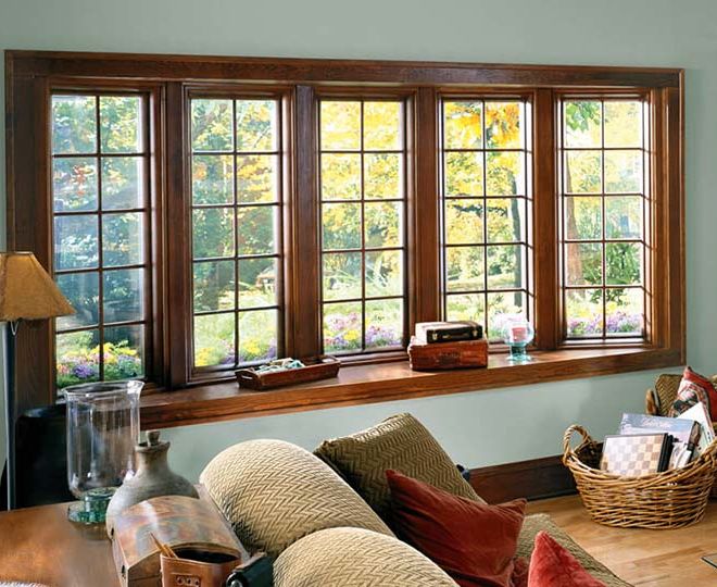 home interior with large bow windows spanning living room, creating shelf