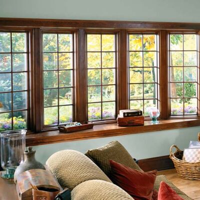 home interior with large bow windows spanning living room, creating shelf