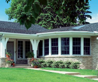 home exterior double hung windows with decorative grilles span side of house