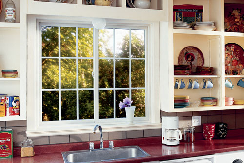 home interior kitchen two gliding / sliding windows with decorative grilles above sink