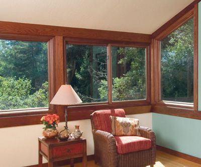 home interior living room four sliding / gliding windows provide natural sunlight