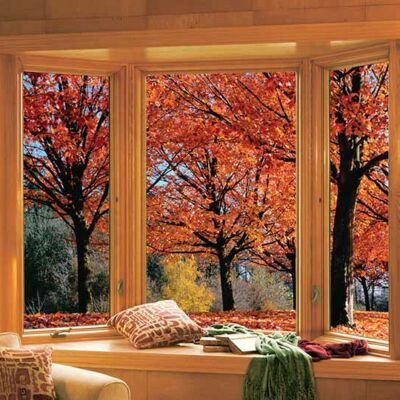 home interior with large bay windows creating a living room seating nook