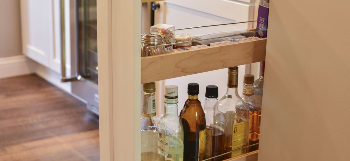 narrow, white base cabinet drawer with three unique storage levels